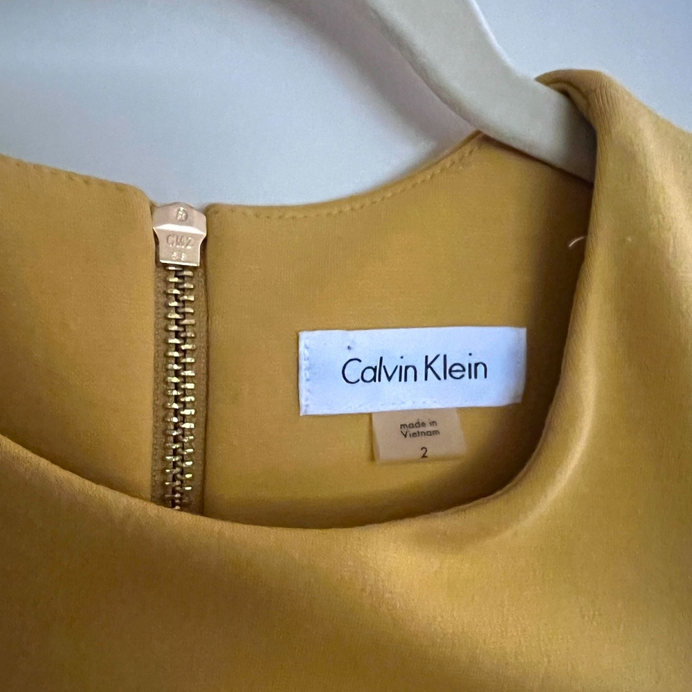 Calvin Klein mustard yellow sheath dress.